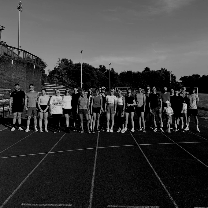 Elev8 Running Club members on a track